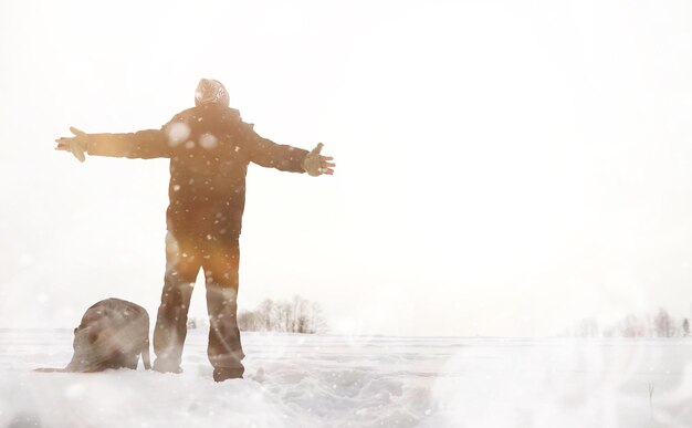 A man on a walk Winter landscape Tourist in winter journey