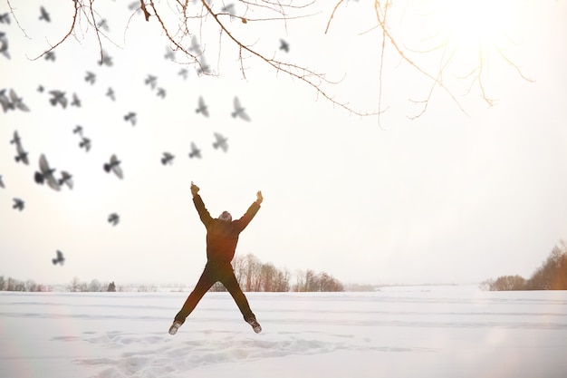 A man on a walk. Winter landscape. Tourist in the winter journey.