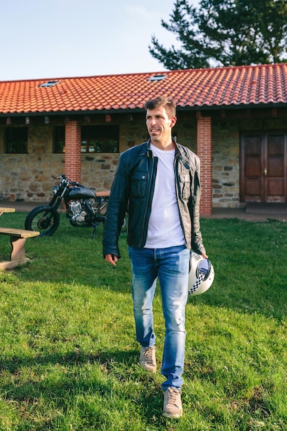 Man walking and custom motorcycle in background