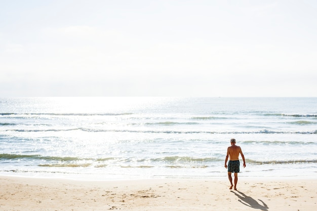 Man walking down the beach