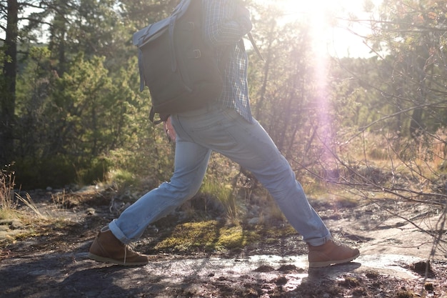 Man walking on a path through the forest