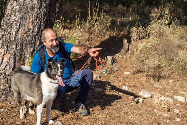 Man walking and playing with his dog