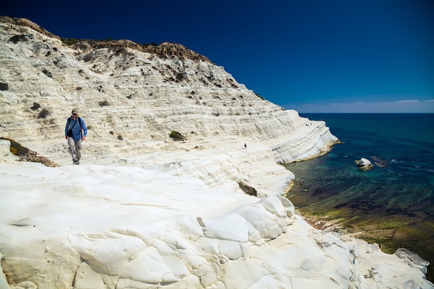 Man walking at the Scala dei Turchi