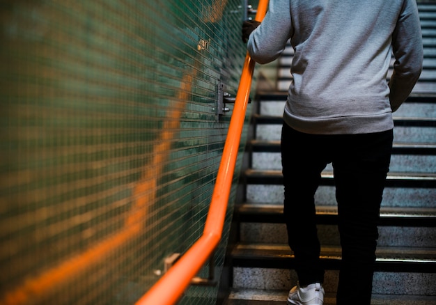 Man walking up some stairs