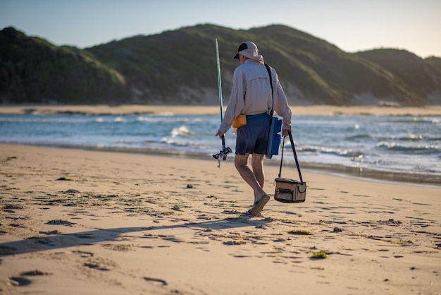 Man walking with his fishing gear