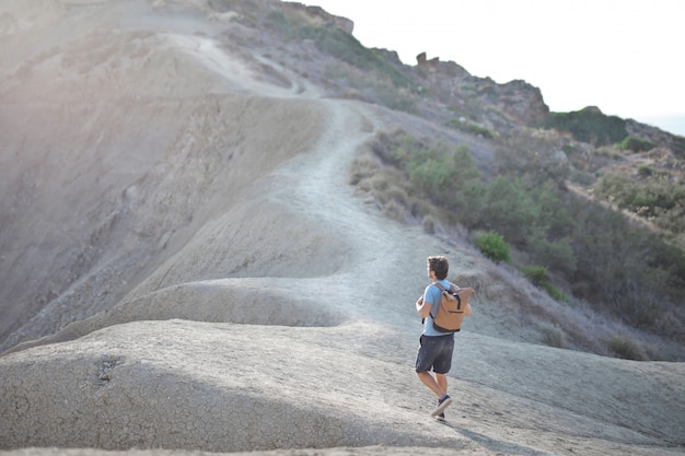 man walks on a mountain