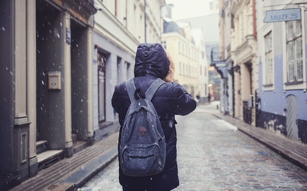 Man walks through an old town