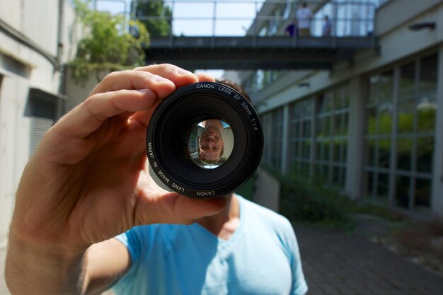 Photo man on walkway seen through lens