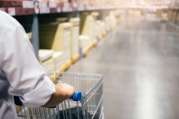 Man warehouse worker checking goods at warehouse.