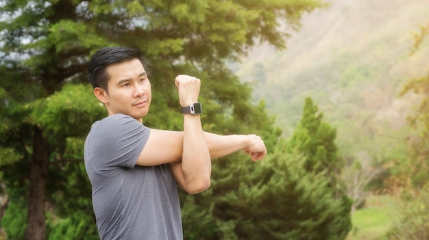 Man warm up his body prepare exercise in the morning.