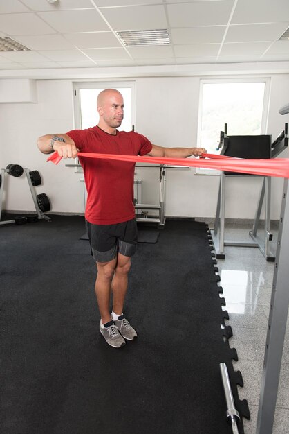 Man Warms Up With the Latex Resistance Band