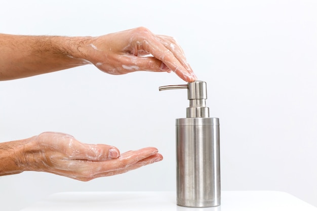 man washing hands isolated over white background