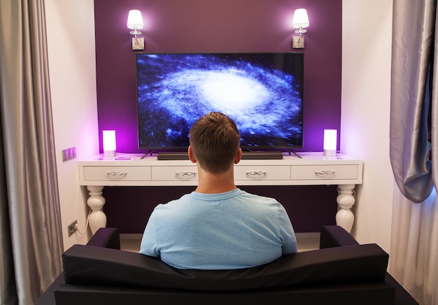 Man watching 4K TV