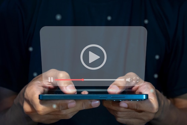 a man watching a video or movie via a smart phone video streaming on internet concept