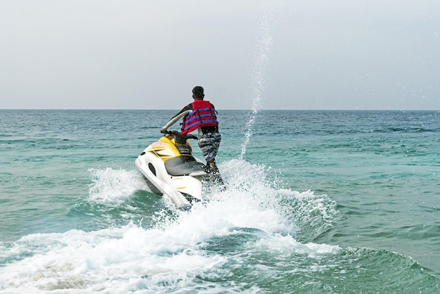 Man on a water motorcycle on the sea