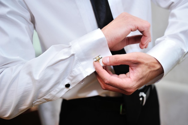 Man wear a shirt and cufflinks