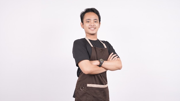 The man wearing the apron stands on an isolated white background