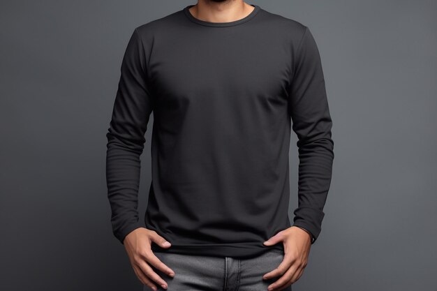 man wearing black long sleeve tshirt against gray background