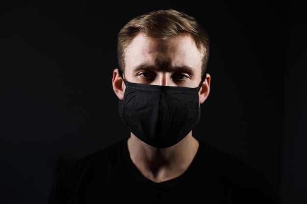 man wearing a black medical mask