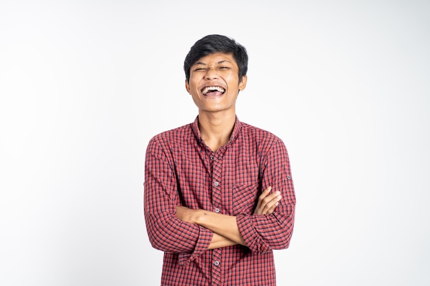 Man wearing black tshirt smiling with arms crossed