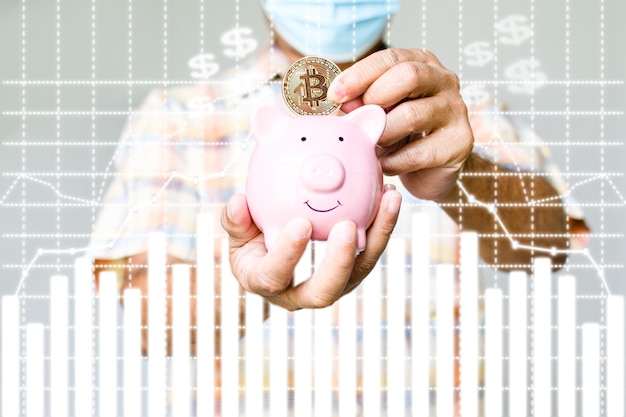 man wearing a blue mask stands holding bitcoin putting piggy bank