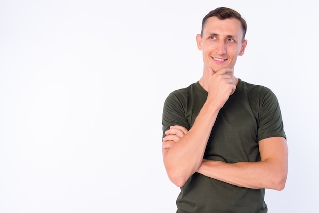 man wearing casual clothing isolated against white wall
