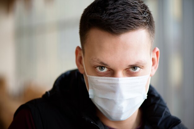 man wearing a face mask in airport