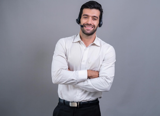 A man wearing a headset and smiling at the camera