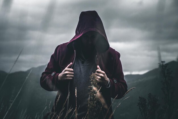 Man wearing jacket against sky