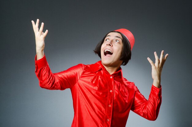 Man wearing red fez hat