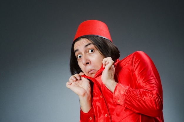 Man wearing red fez hat