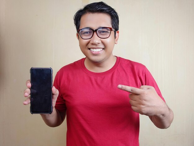 Man wearing a red tshirt with an expression