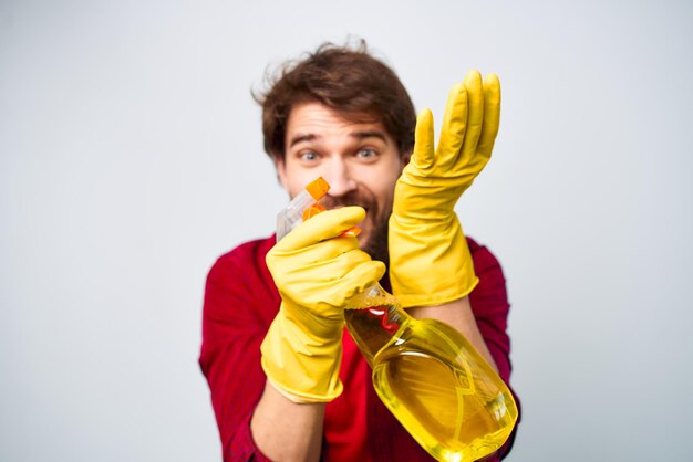 Man wearing rubber gloves detergent homework lifestyle High quality photo