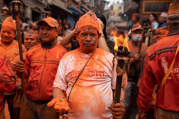 A man wearing a shirt that says holi on it