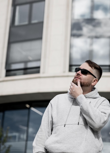 man wearing stylish gray hoodie