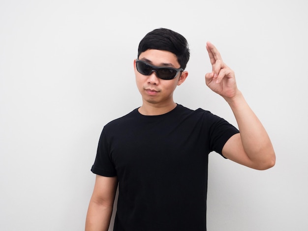 Man wearing sunglasses motion hand white background