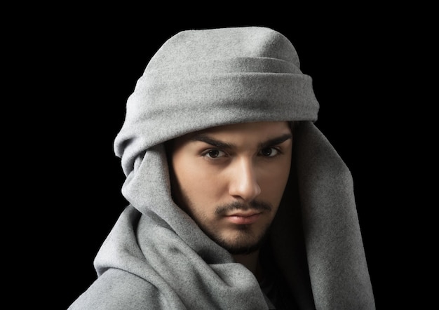 Man wearing a turban studio portrait dark background