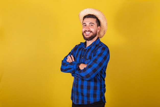 Man wearing typical clothes for festa junina with arms crossed