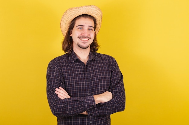 Man wearing typical clothes for party Junina Arms crossed showing confidence