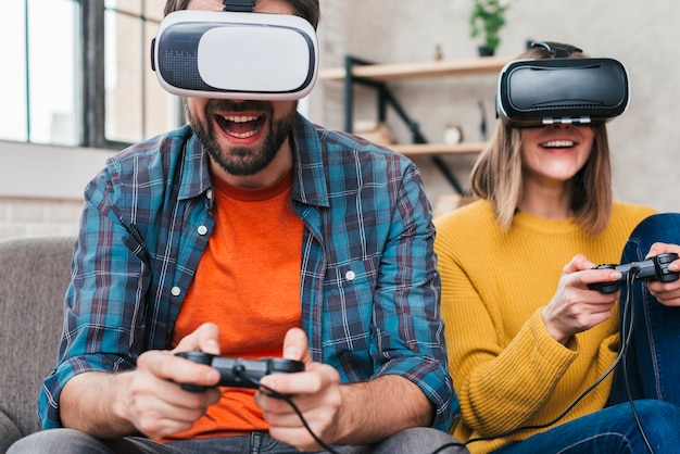 Photo man wearing virtual reality glasses playing with joystick