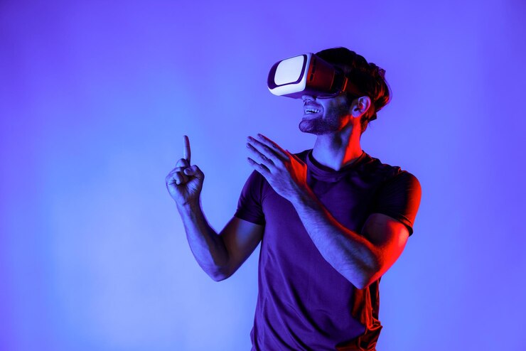 Photo man wearing virtual reality goggle while standing at neon light deviation