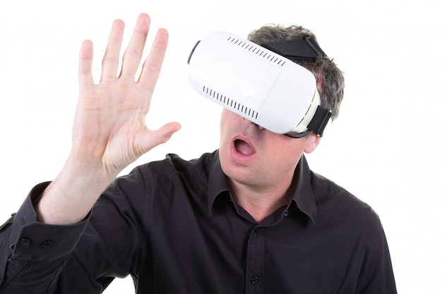 Man wearing white virtual reality headset having great fun