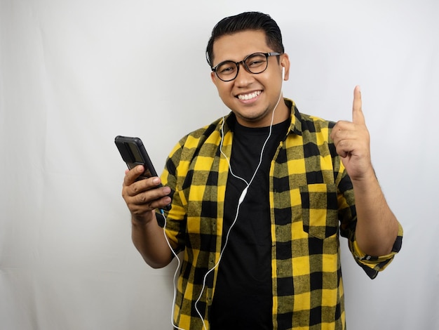 a man wearing a yellow plaid jacket with the word " on it "