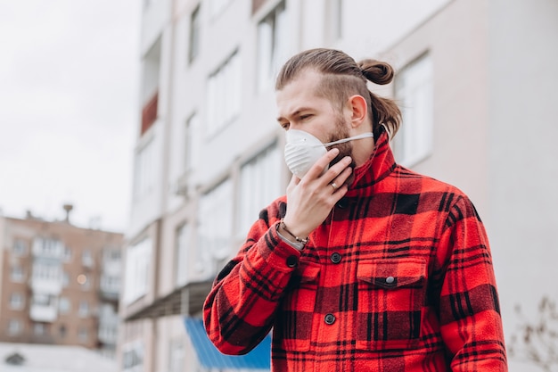 man wears medical mask in the street