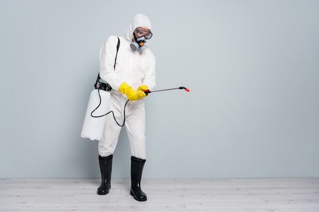 man wears special protective suit and mask