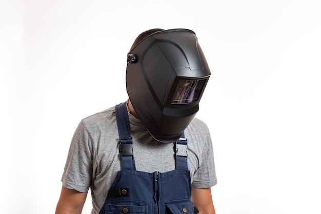 A man in a welding mask and robo-robe clothes, on a white background.