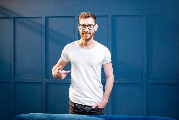 Man in white tshirt on the blue background