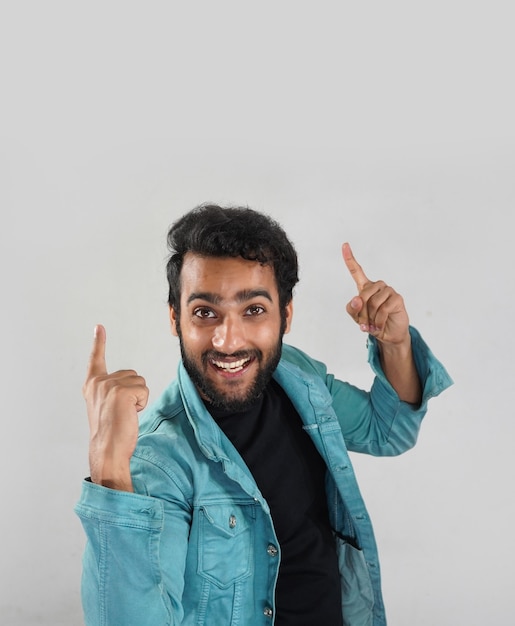  a man who is showing something on top by his hand