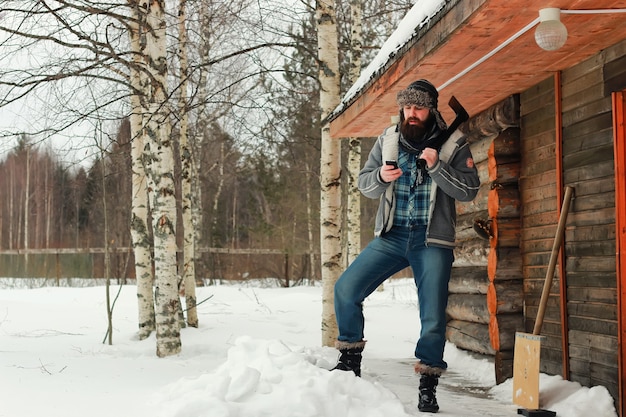 Man in winter with axe