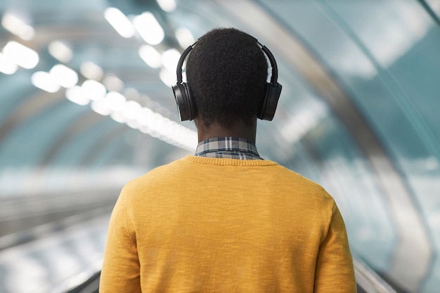 Man in wireless headphones listening to music